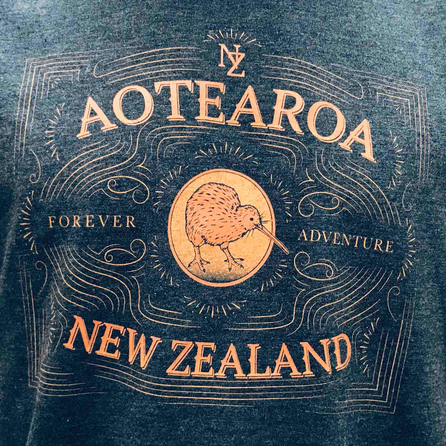 Mens New Zealand T Shirt-Forever Adventure Blue marle coloured T-Shirt. Kiwi emblem design. Wild Kiwi Clothing, New Zealand. www.wild-kiwi.co.nz