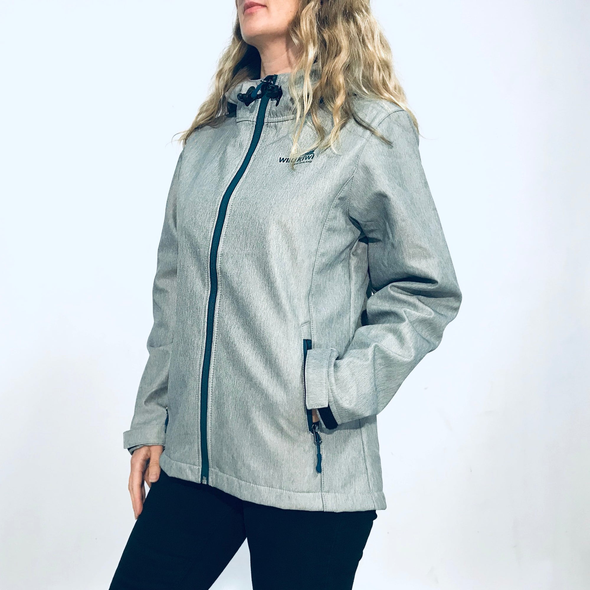 Women&#39;s grey hooded soft shell jacket with blue lining and zips. Water resistant tech shell. www.wild-kiwi.co.nz
