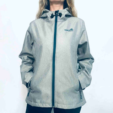 Women's grey hooded soft shell jacket with blue lining and zips. Water resistant tech shell. www.wild-kiwi.co.nz